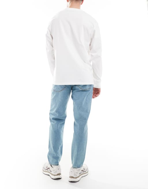 Vaqueros con lavado azul claro tintado de corte tapered de ASOS DESIGN , 2 de 5