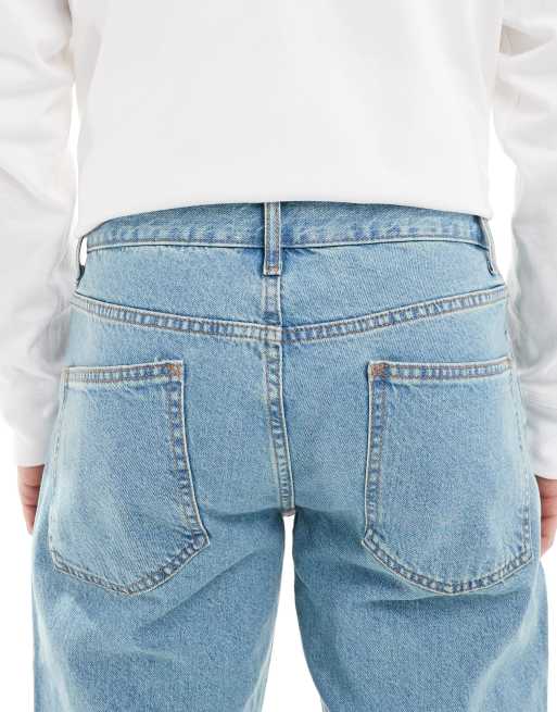 Vaqueros con lavado azul claro tintado de corte tapered de ASOS DESIGN , 4 de 5