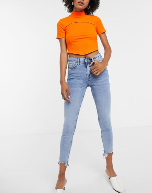 Vaqueros con lavado descolorido y detalle de bajos rasgados Jamie de Topshop 