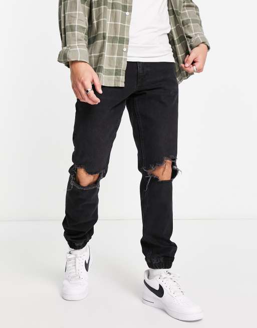 Vaqueros con lavado negro de corte slim con bajos elásticos de ASOS DESIGN  