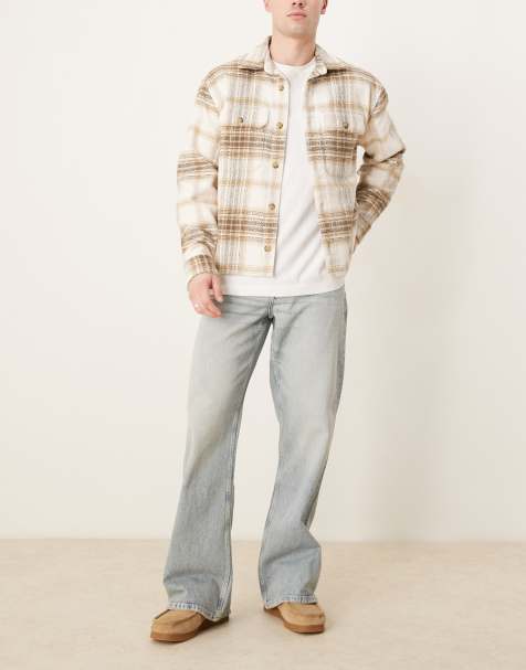 Vaqueros de corte acampanado ancho con lavado descolorido de ASOS DESIGN - view 1