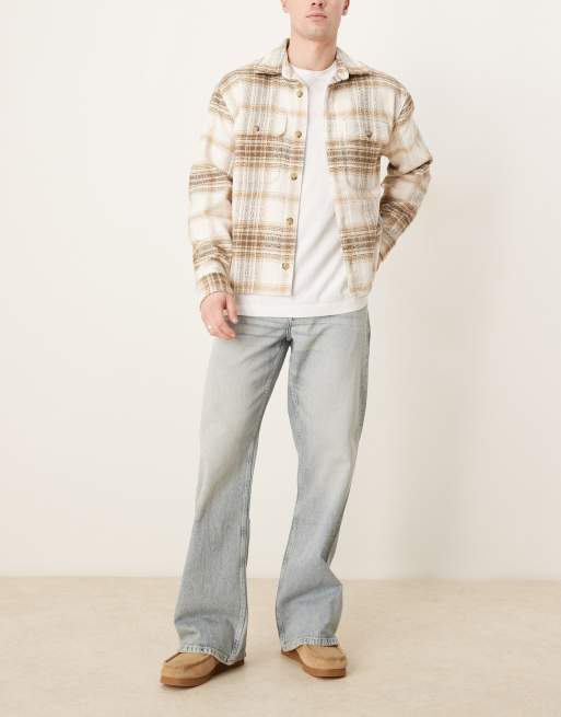 Vaqueros de corte acampanado ancho con lavado descolorido de ASOS DESIGN