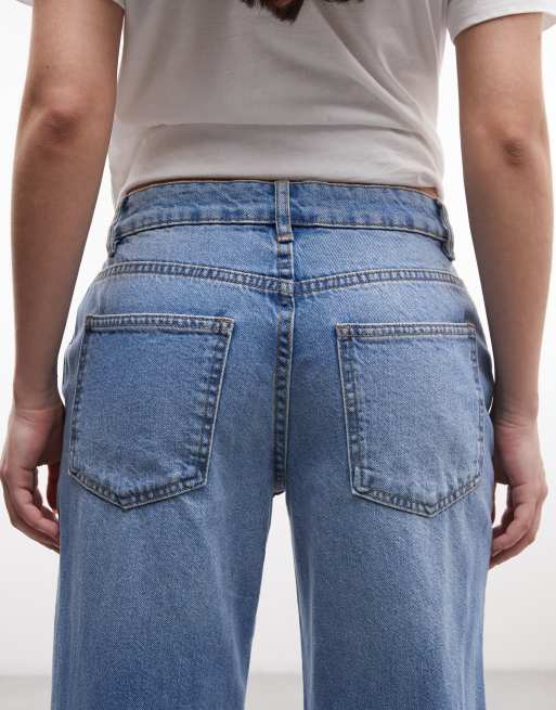 Vaqueros de corte holgado acampanado con lavado medio claro de ASOS DESIGN, 5 de 5