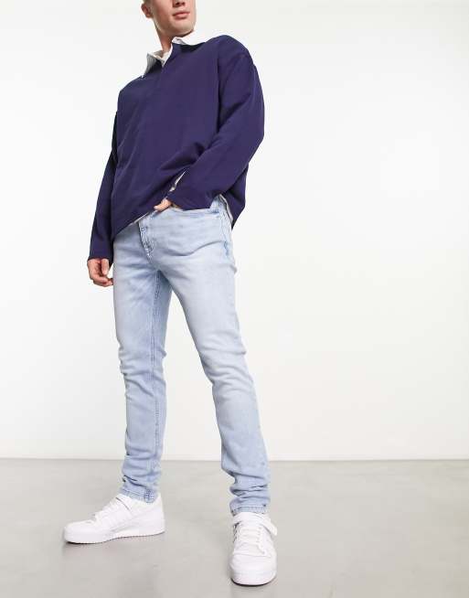 Vaqueros de corte pitillo con lavado azul claro de Tommy Jeans ASOS
