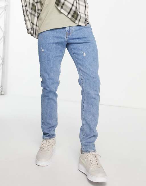 Vaqueros de corte pitillo con lavado claro y abrasiones de ASOS DESIGN 