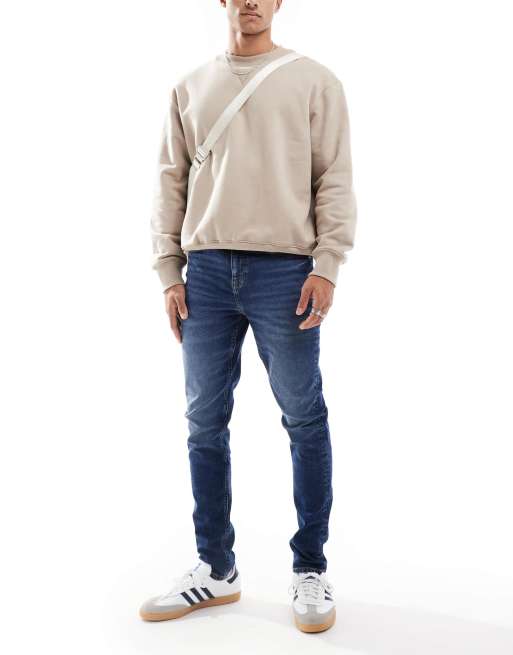 Vaqueros de corte pitillo con lavado oscuro envejecido de ASOS DESIGN