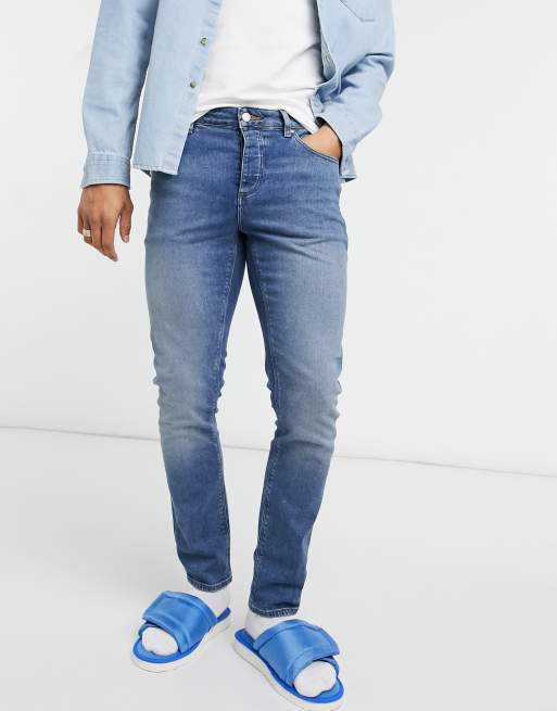 Vaqueros de corte slim azul lavado medio vintage elásticos de ASOS DESIGN