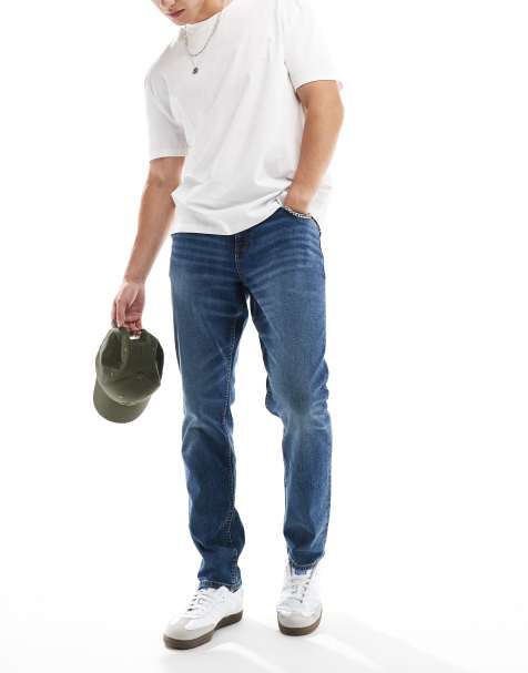 Vaqueros de corte slim elástico con lavado azul medio de ASOS DESIGN - view 1