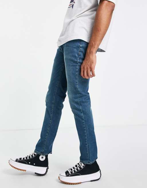 Vaqueros de corte slim elástico con lavado azul medio de mezcla de algodón de Topman - MBLUE