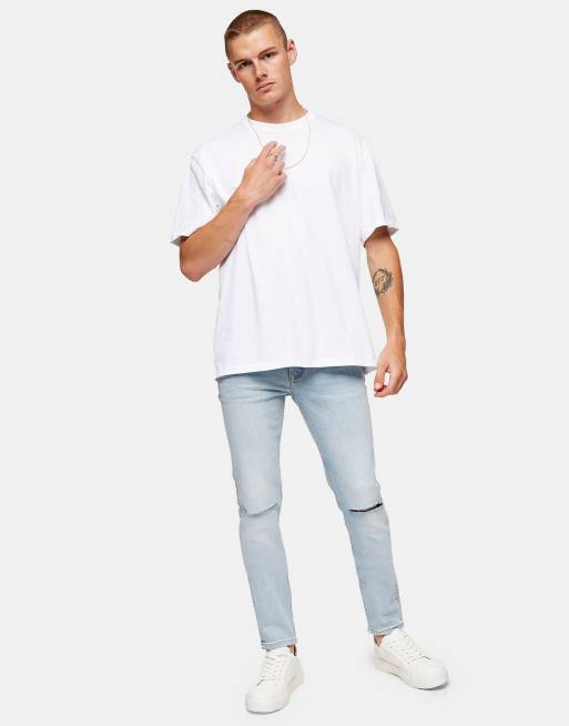 Vaqueros de corte slim elástico con lavado azul medio de mezcla de algodón de Topman - MBLUE