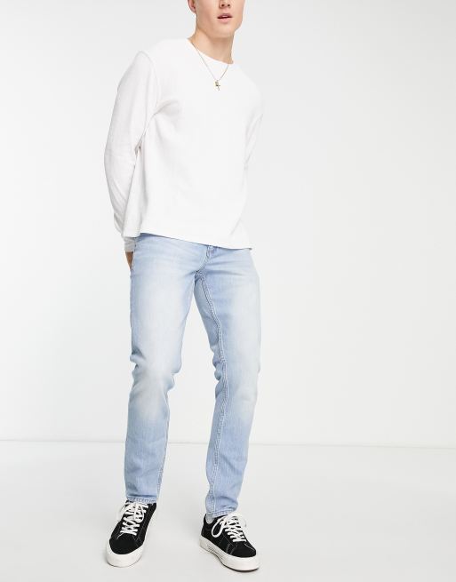Vaqueros de corte slim en azul con lavado claro de ASOS DESIGN  