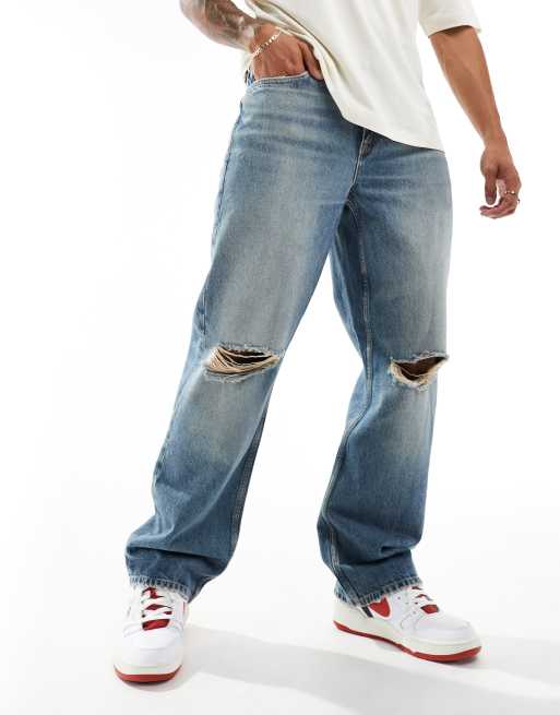 Vaqueros de corte suelto con lavado azul medio y diseño rasgado de River Island