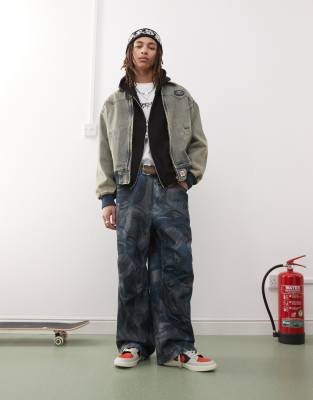 Vaqueros de corte suelto con lavado azul y patrón de jacquard de AAPE BY A BATHING APE® - view 1