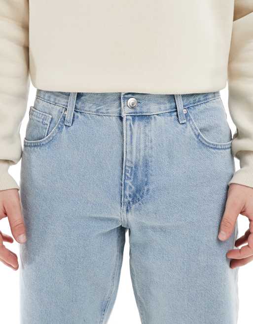 Vaqueros de corte tapered con lavado azul claro a la piedra de ASOS DESIGN, 5 de 5