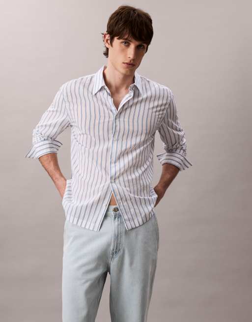 Vaqueros de corte tapered con lavado descolorido de estilo años 90 de Calvin Klein Jeans, 4 de 5