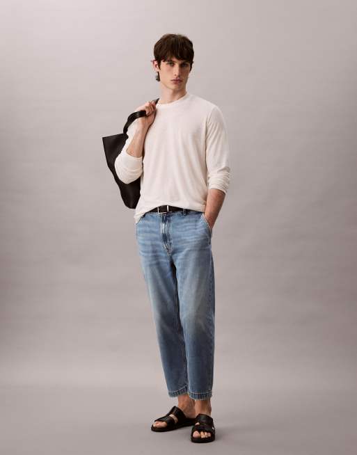 Vaqueros de corte tapered con lavado descolorido de estilo años 90 de Calvin Klein Jeans