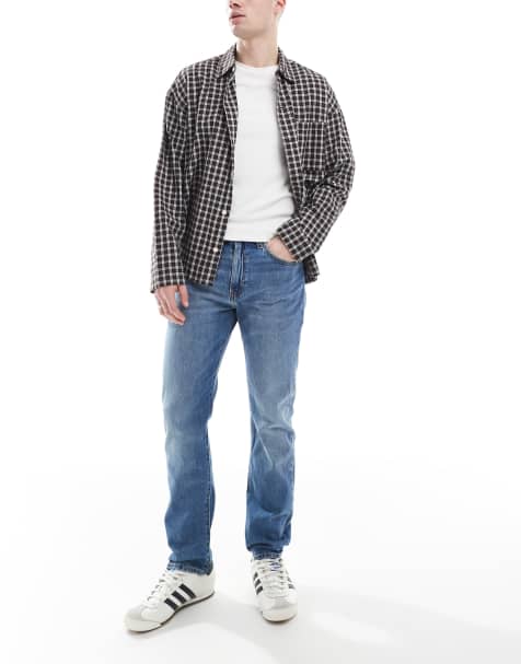 Vaqueros de corte tapered con lavado medio 502 de Levi's - view 1