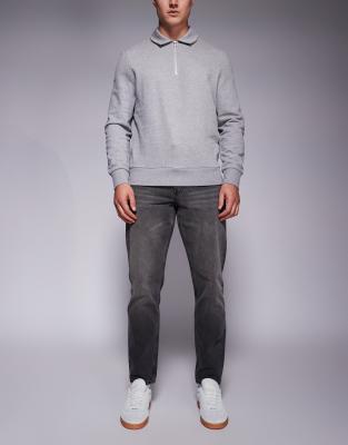 Vaqueros de corte tapered con lavado negro tintado de ASOS DESIGN - view 1