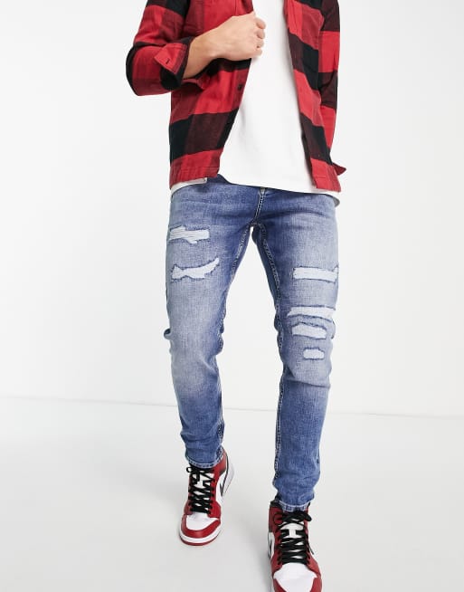 Vaqueros de corte tapered con lavado oscuro y diseño rasgado reparado de Topman
