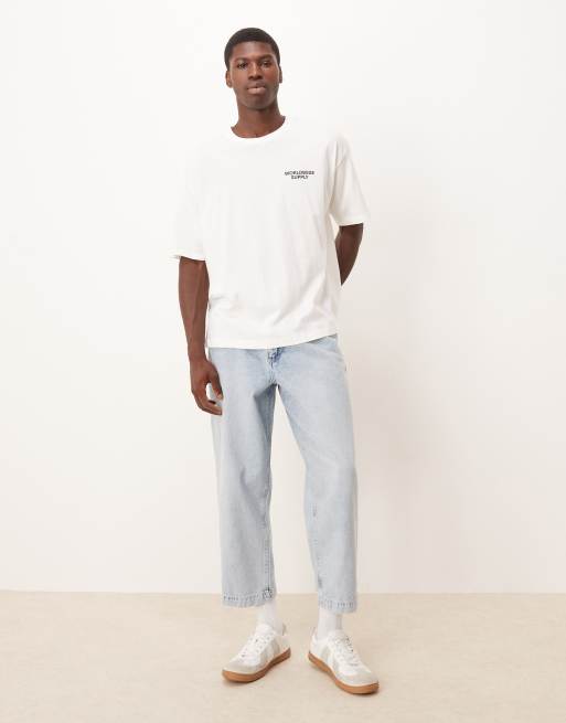 Vaqueros de corte tapered holgado con lavado descolorido y pinzas de ASOS DESIGN