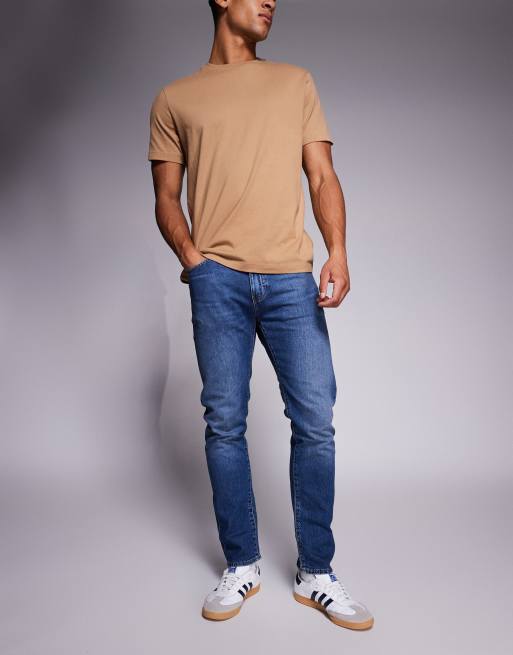 Vaqueros de corte tapered slim con lavado claro envejecido 512 de Levi's 