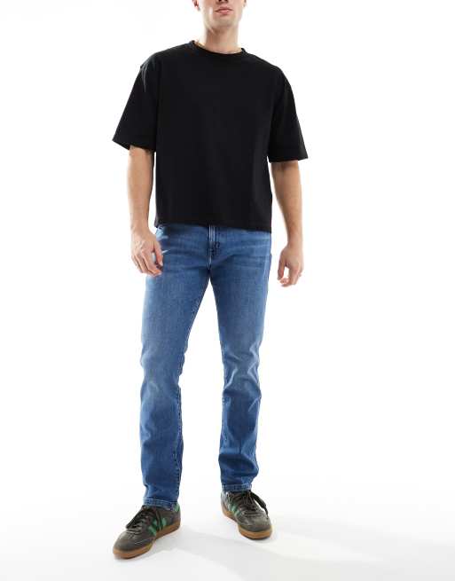 Vaqueros de corte tapered slim con lavado claro Larston de Wrangler