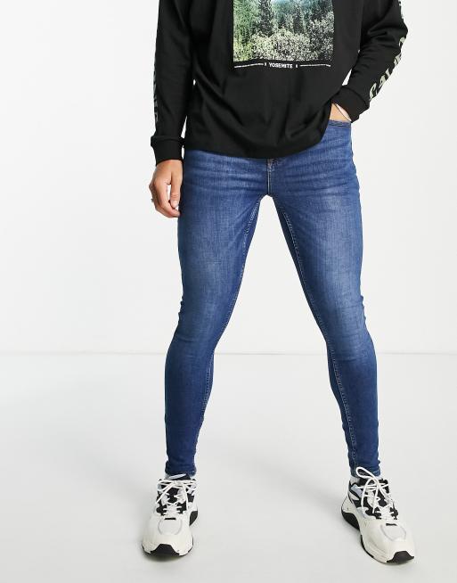 Vaqueros de efecto espray con lavado medio de Topman 