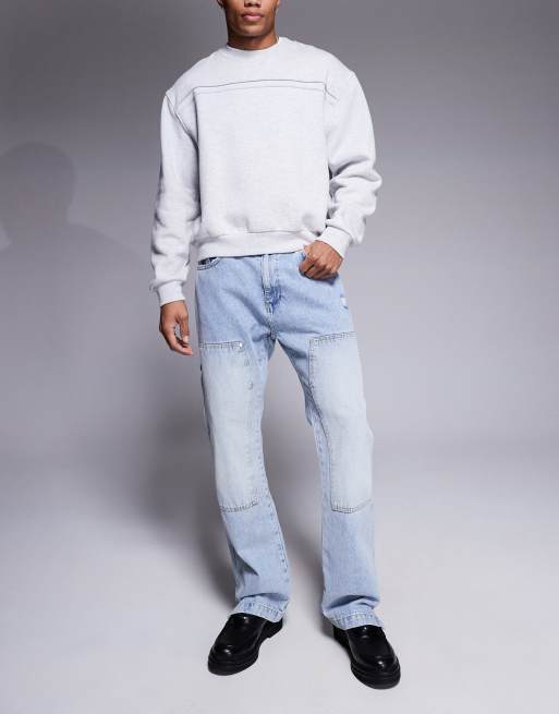 Vaqueros de estilo carpintero con lavado azul y detalle de remaches de The Couture Club 