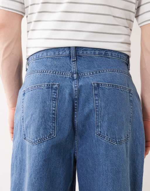 Vaqueros de pernera ancha con lavado azul medio y detalle anudado de ASOS DESIGN, 4 de 5