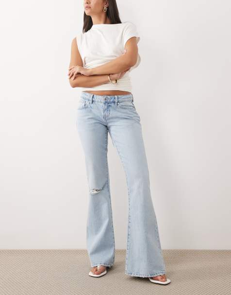 Vaqueros de talle bajo y corte acampanado con lavado azul claro y diseño rasgado de Gina Tricot - view 1