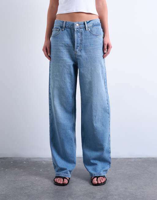 Vaqueros de talle medio bajo con acabado descolorido Column de Topshop
