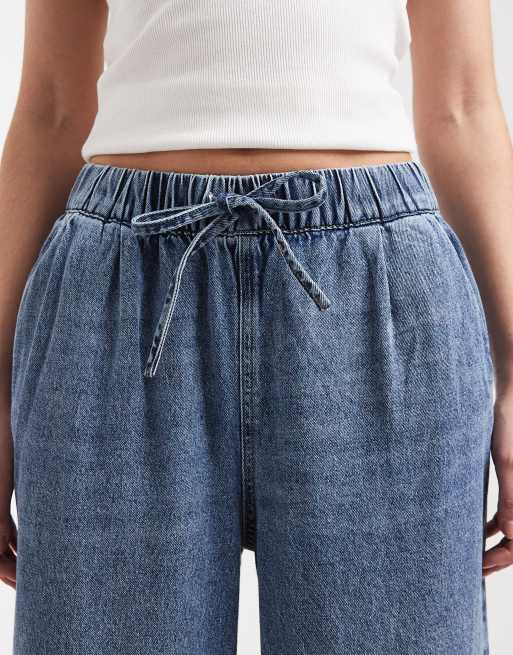 Vaqueros de talle medio y pernera ancha sin cierres con lavado azul medio Valeria de Vero Moda, 4 de 5