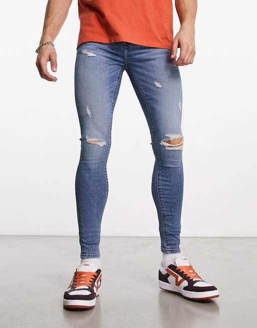 Vaqueros en tejido elástico azul lavado medio Spray On de ASOS DESIGN