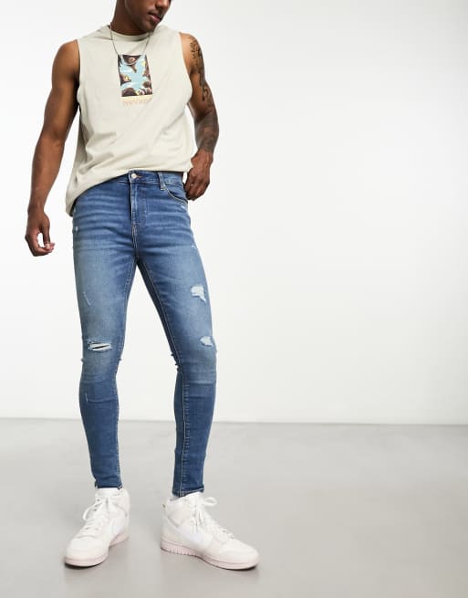 Vaqueros en tejido elástico azul lavado medio Spray On de ASOS DESIGN