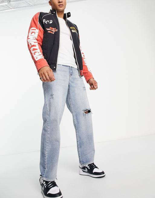 Vaqueros holgados con lavado azul claro y diseño rasgado de ASOS DESIGN