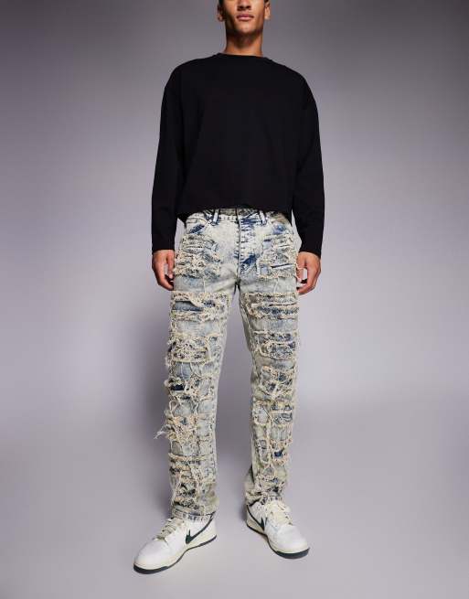 Vaqueros holgados con lavado azul claro y diseño rasgado y remendado superpuesto de Liquor N Poker