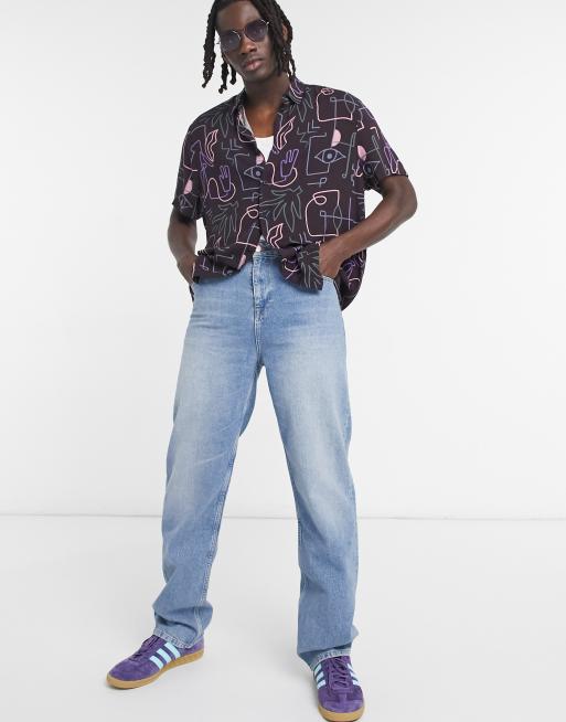 Vaqueros holgados con lavado azul medio vintage de ASOS DESIGN
