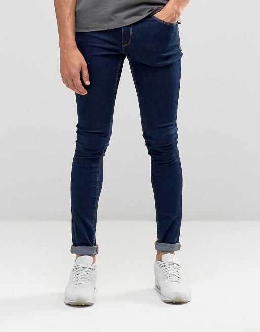 Vaqueros muy ajustados en azul crudo de ASOS DESIGN