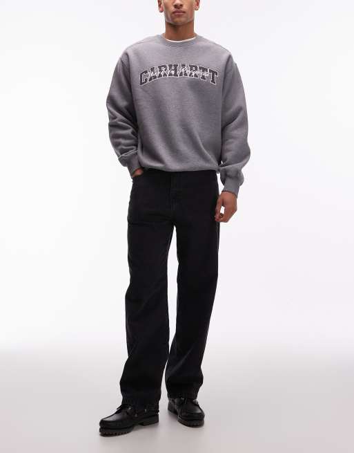 Vaqueros negro descolorido de corte tapered suelto Landon de Carhartt WIP