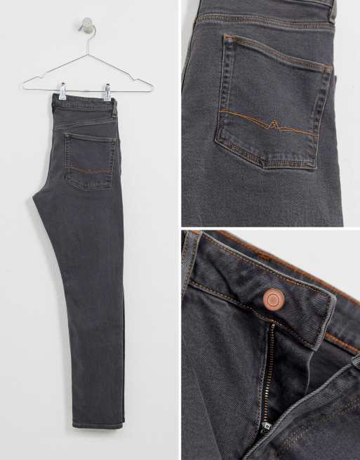 Vaqueros negro desgastado de corte slim elástico de ASOS DESIGN, 4 de 4
