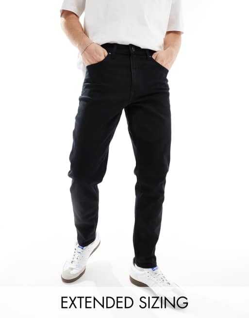Vaqueros negro intenso elásticos de corte tapered de ASOS DESIGN