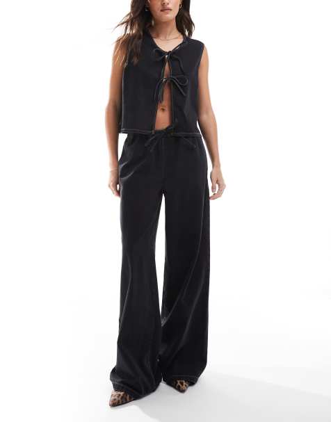 Vaqueros negro lavado de pernera ancha con lazada delantera de ASOS DESIGN - view 1