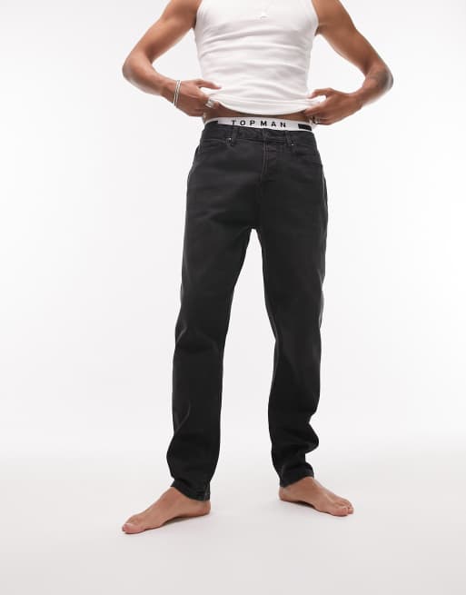 Vaqueros negro lavado elásticos de corte tapered de Topman 