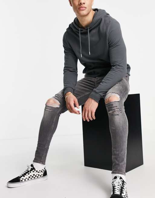 Vaqueros negro lavado superajustados con diseño elástico y roturas marcadas de ASOS DESIGN