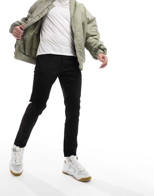 Vaqueros negros de corte tapered slim de Selected Homme 