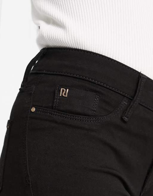 Vaqueros negros de talle medio y corte pitillo Molly de River Island Petite, 3 de 4