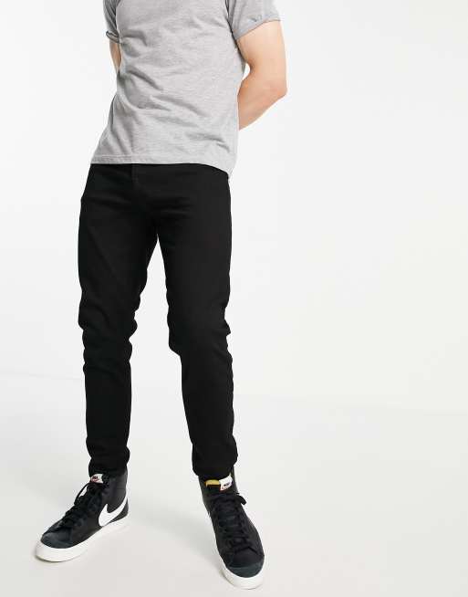 Vaqueros negros elásticos tapered de Topman