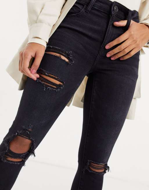 Jeans negros para mujeres: De tiro alto, rasgados y más