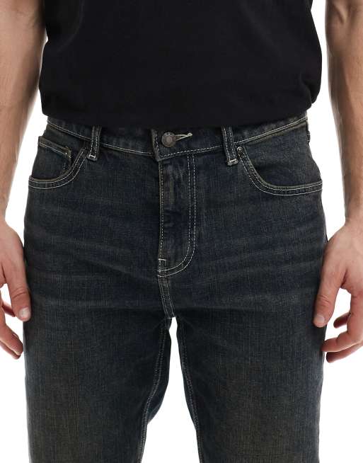 Vaqueros pitillo con lavado azul oscuro tintado de ASOS DESIGN, 5 de 5