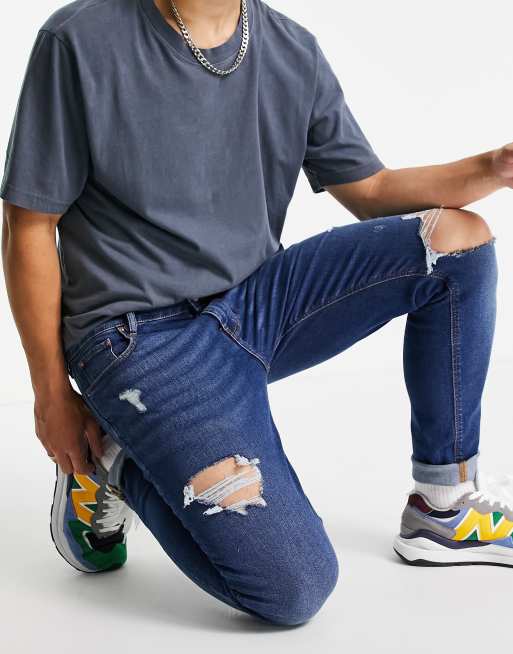 Vaqueros pitillo lavado y detalles de rotos de ASOS DESIGN | ASOS